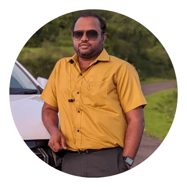 Vinay Pol standing near a bookshelf