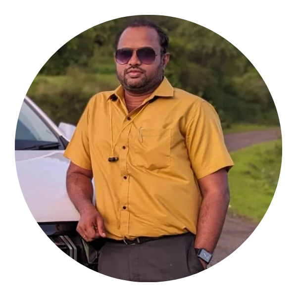 Vinay Pol standing near a bookshelf